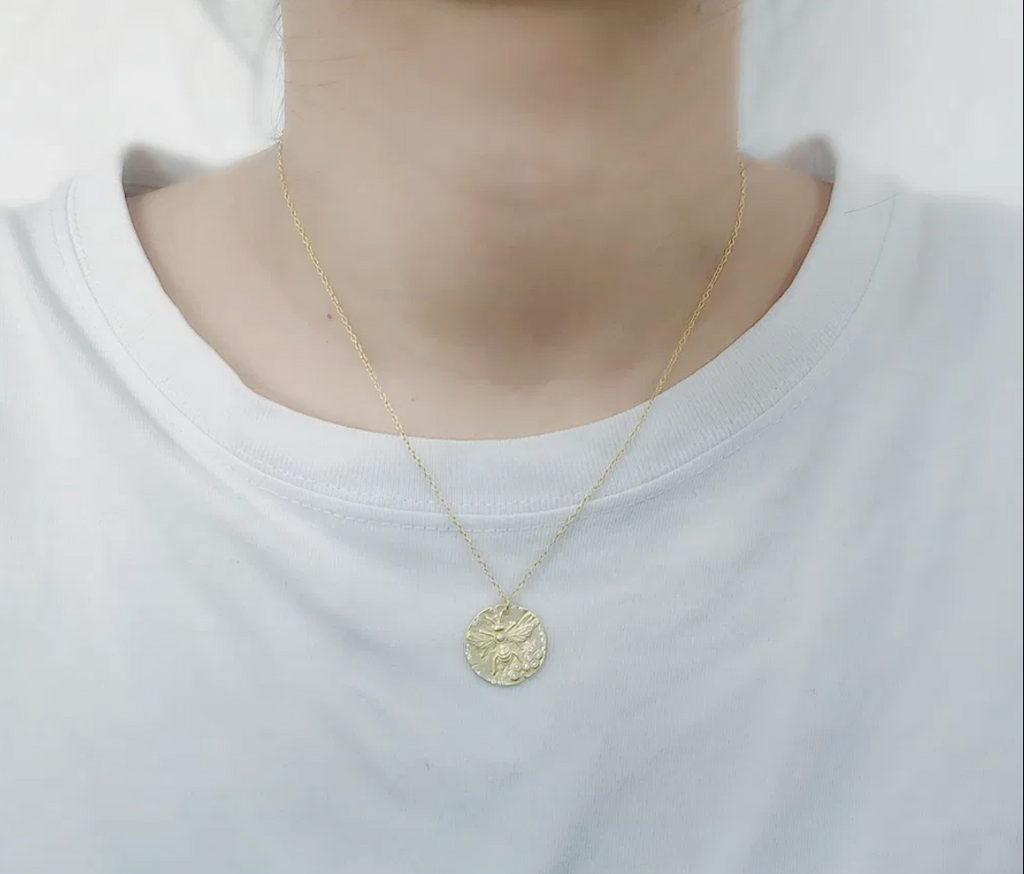 Gold Bee Coin Necklace lifestyle shot
