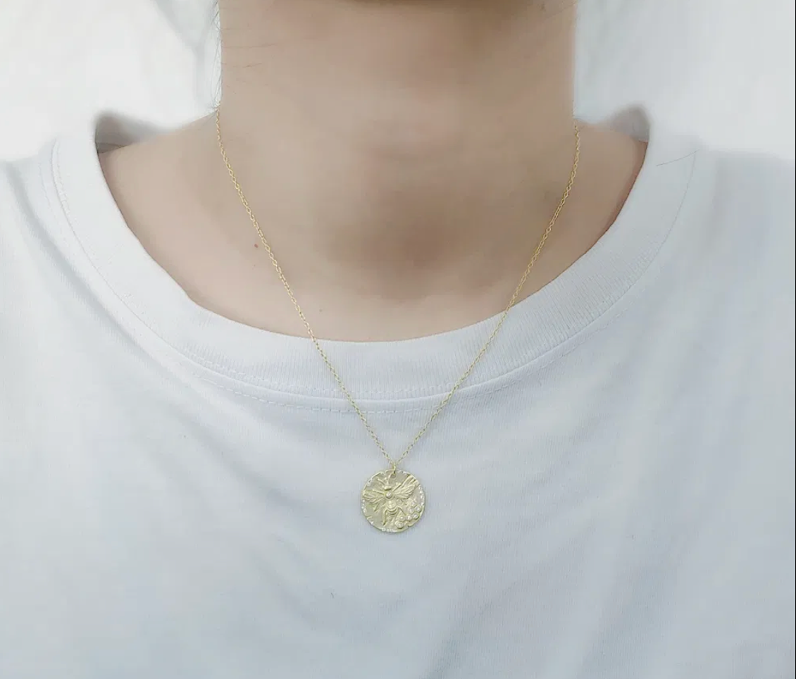 Gold Bee Coin Necklace lifestyle shot